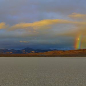 panorama view of rainbow over the Racetrack Death Valley National Park