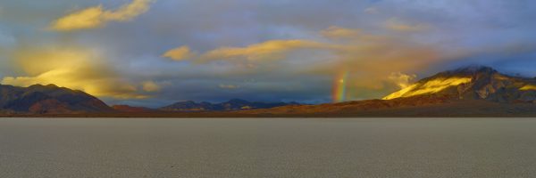 panorama view of rainbow over the Racetrack Death Valley National Park