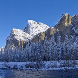 the Cathedral Rocks and Leaning Tower in winter snow Yosemite National Park