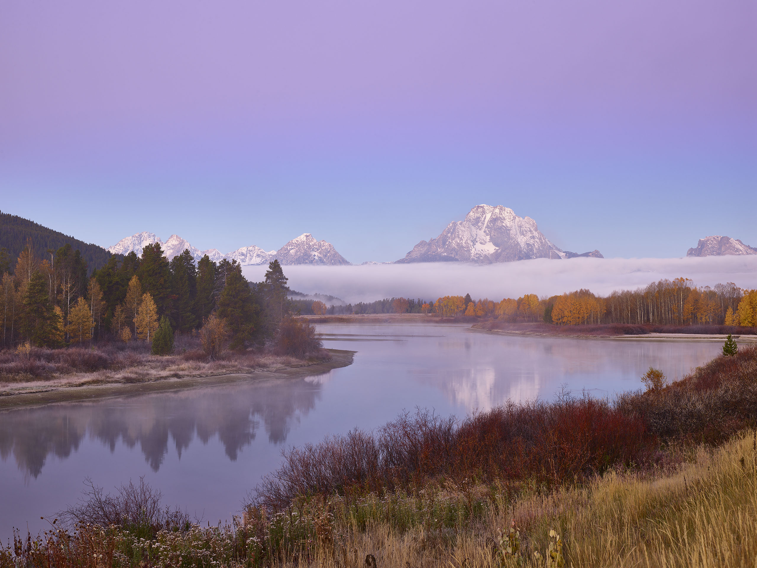 A fall morning before the sun hits the peaks at the Oxbow Bend Tetons National Park
